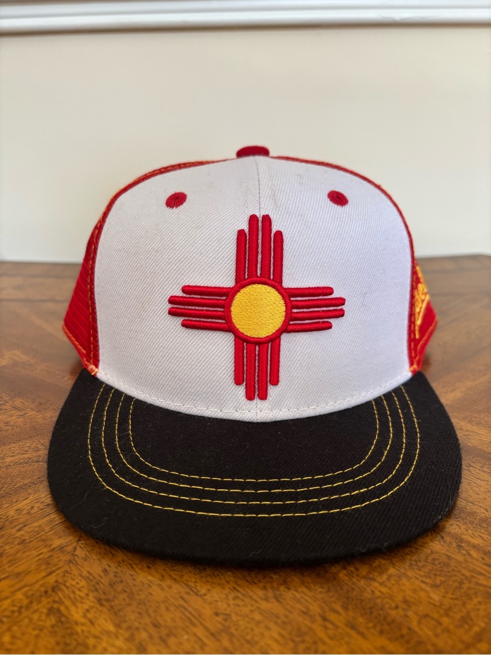 Red and White Aksels Zia Symbol Trucker Hat - Yellow Accent